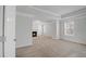 Bedroom featuring a fireplace, a tray ceiling, and two windows at 2536 Dayview Ln, Atlanta, GA 30331