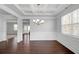 Bright dining room with hardwood floors, decorative wainscoting, and a chandelier at 2536 Dayview Ln, Atlanta, GA 30331