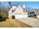 Charming two-story home with a brick facade, two-car garage, and inviting front porch at 2536 Dayview Ln, Atlanta, GA 30331