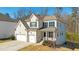 Charming two-story home with a brick facade, two-car garage, and inviting front porch at 2536 Dayview Ln, Atlanta, GA 30331