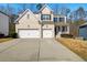 Charming two-story home with a brick facade, two-car garage, and inviting front porch at 2536 Dayview Ln, Atlanta, GA 30331