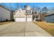 Charming two-story home with a brick facade, two-car garage, and inviting front porch at 2536 Dayview Ln, Atlanta, GA 30331