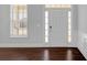 Bright foyer with dark hardwood floors, white trim and a large window for lots of natural light at 2536 Dayview Ln, Atlanta, GA 30331