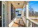 Inviting front porch with wood flooring and white columns, offering a charming outdoor space at 2536 Dayview Ln, Atlanta, GA 30331