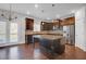 Bright kitchen featuring an island, stainless appliances, dark cabinets, and hardwood floors at 2536 Dayview Ln, Atlanta, GA 30331