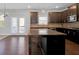 Spacious kitchen featuring dark cabinets, stainless steel appliances, and an island with granite countertops at 2536 Dayview Ln, Atlanta, GA 30331