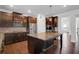 Spacious kitchen featuring dark cabinets, stainless steel appliances, and an island with granite countertops at 2536 Dayview Ln, Atlanta, GA 30331