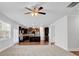 Open-concept living room and kitchen featuring dark cabinets and hardwood floors at 2536 Dayview Ln, Atlanta, GA 30331