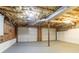 Unfinished basement with exposed ceiling and two garage doors at 356 Waterway Trl, Powder Springs, GA 30127