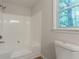 Bathroom features an all-white tub/shower combination and a toilet at 356 Waterway Trl, Powder Springs, GA 30127