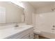Clean and bright bathroom with white vanity, large mirror, and shower-tub combo at 356 Waterway Trl, Powder Springs, GA 30127