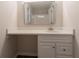 Bright bathroom vanity with a granite countertop, modern faucet and classic white cabinets at 356 Waterway Trl, Powder Springs, GA 30127