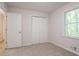 Neutral bedroom with carpet, window and closet at 356 Waterway Trl, Powder Springs, GA 30127