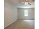 The room features neutral carpeting and a lighted ceiling fan at 356 Waterway Trl, Powder Springs, GA 30127