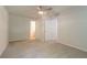 Spacious bedroom features a ceiling fan and neutral carpet, with multiple closets and access to an ensuite bathroom at 356 Waterway Trl, Powder Springs, GA 30127