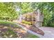 Charming home with a covered front porch, dormer windows, and landscaped front yard at 356 Waterway Trl, Powder Springs, GA 30127