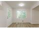 Sunlit room featuring new floors, neutral paint, and a window overlooking the backyard at 356 Waterway Trl, Powder Springs, GA 30127