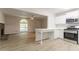 Open concept living space with modern kitchen, stone fireplace and large window for lots of natural light at 356 Waterway Trl, Powder Springs, GA 30127