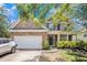 Charming two-story brick home featuring a two-car garage and a welcoming front porch at 485 Greyhawk Way, Fairburn, GA 30213