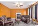 Comfortable living room with a fireplace, plush seating, and natural light at 485 Greyhawk Way, Fairburn, GA 30213