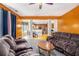 Spacious living room with plush seating that adjoins dining area at 485 Greyhawk Way, Fairburn, GA 30213