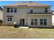 The backyard features a large grassy area and a patio, perfect for outdoor entertaining at 5625 Jamerson Dr, Atlanta, GA 30349