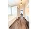A primary bathroom includes a jacuzzi-style tub, a privacy wall, and double sinks at 5625 Jamerson Dr, Atlanta, GA 30349