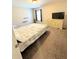 Bright bedroom with a window, dresser, and neutral walls creating a cozy living space at 5625 Jamerson Dr, Atlanta, GA 30349