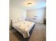 Cozy bedroom featuring patterned bedding and neutral walls, creating a relaxing atmosphere at 5625 Jamerson Dr, Atlanta, GA 30349