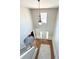 A high angle view of the foyer shows the chandelier, the front door, and the railing at 5625 Jamerson Dr, Atlanta, GA 30349