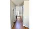 Hallway with hardwood floors leading to a bright entryway, offering a welcoming path at 5625 Jamerson Dr, Atlanta, GA 30349