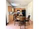 An eat-in kitchen area shows the table and chair setting and the kitchen in the background at 5625 Jamerson Dr, Atlanta, GA 30349