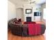 The living room offers a fireplace, built-in shelves, a ceiling fan, and a comfy leather couch at 5625 Jamerson Dr, Atlanta, GA 30349