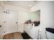 Bright bathroom with white cabinets, ample counter space, wood-look floors and modern fixtures at 108 Park Pl # 108, Atlanta, GA 30030