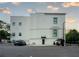 Exterior view of a modern white building with ample parking and well-maintained surroundings at 108 Park Pl # 108, Atlanta, GA 30030