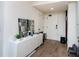 Well-lit foyer with hardwood floors, a modern console table, and a decorative mirror, creating a welcoming entrance at 108 Park Pl # 108, Atlanta, GA 30030