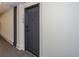 Hallway leading to unit #108 of a modern apartment building, carpet flooring and neutral walls at 108 Park Pl # 108, Atlanta, GA 30030