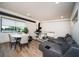 Modern living room with a gray reclining sofa, round dining table and workstation at 108 Park Pl # 108, Atlanta, GA 30030