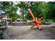 Public park with a large sculpture, benches and sidewalks surrounded by trees at 108 Park Pl # 108, Atlanta, GA 30030