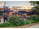 Outdoor dining patio with cafe umbrellas, landscaping and string lights at Universal Joint at 108 Park Pl # 108, Atlanta, GA 30030