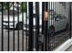 View of a security gate featuring steel bars with a keypad and car entrance, ensuring privacy and security at 108 Park Pl # 108, Atlanta, GA 30030