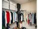 Walk-in closet with ample hanging space, organized shelves, and storage for shoes and accessories at 108 Park Pl # 108, Atlanta, GA 30030