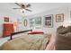 Bright bedroom features a ceiling fan, natural light, and calm decor at 2220 Williams Ln, Cumming, GA 30028