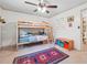 Bright bedroom featuring a bunk bed, ceiling fan, and colorful decor, perfect for children at 2220 Williams Ln, Cumming, GA 30028