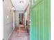 Inviting entryway featuring a bright green front door and attractive wood-look tile flooring at 2220 Williams Ln, Cumming, GA 30028