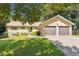 Charming single-Gathering home featuring a well-manicured lawn and attached two-car garage at 2220 Williams Ln, Cumming, GA 30028
