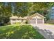Charming single-Gathering home featuring a well-manicured lawn and attached two-car garage at 2220 Williams Ln, Cumming, GA 30028