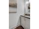Bright bathroom featuring a gray vanity with sleek countertop, undermount sink, and stylish fixtures at 3450 Commander Cv, Suwanee, GA 30024