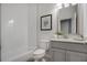 Bathroom featuring modern fixtures, vanity with storage, and a combination tub and shower at 3450 Commander Cv, Suwanee, GA 30024