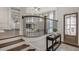 Inviting foyer features hardwood floors, elegant staircase, and a view into the living area at 3450 Commander Cv, Suwanee, GA 30024